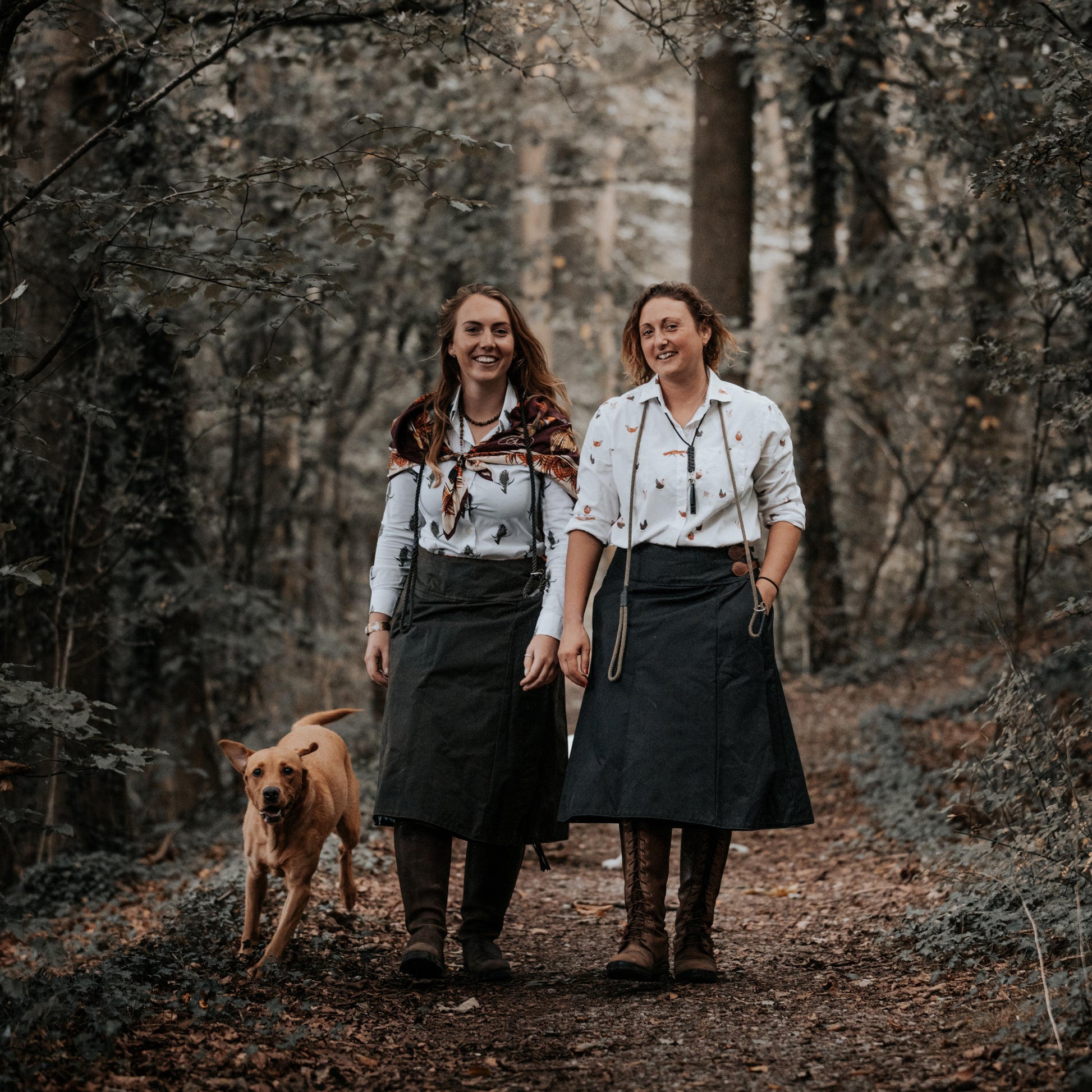 British-made waxed cotton habits being worn while walking though a woodland path.