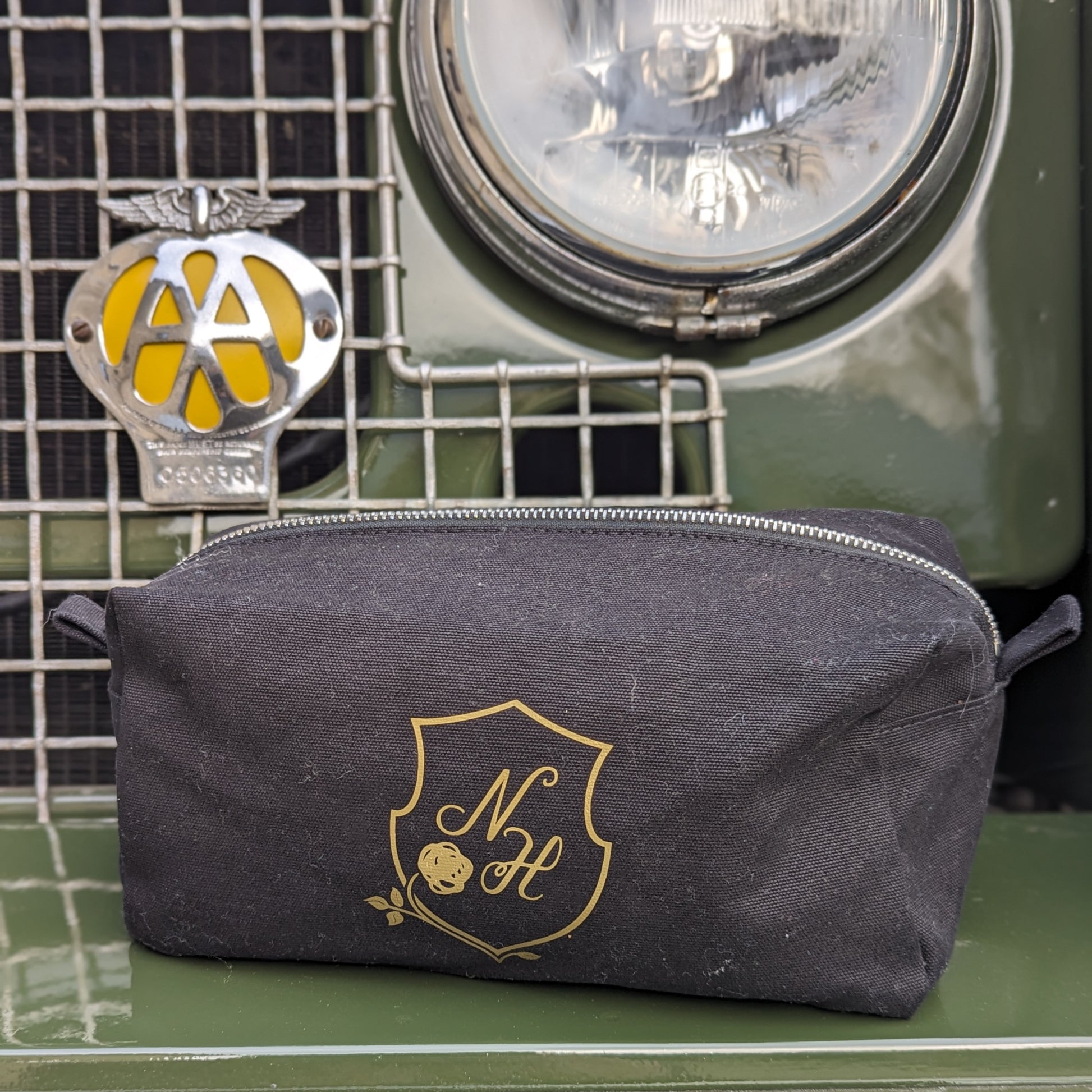 Care kit bag resting on the front of a landrover.