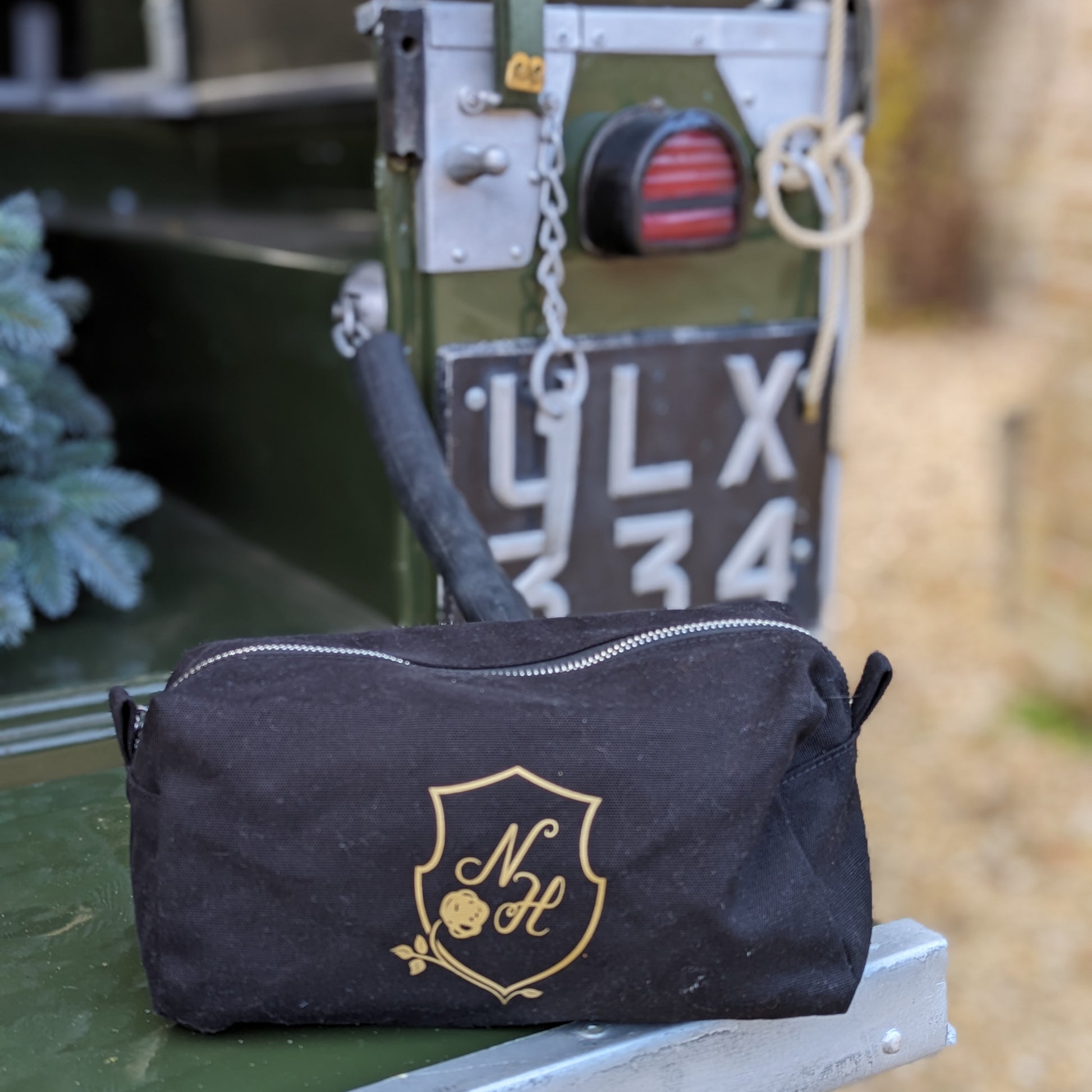 Care kit sat on the tail gate of a vintage landover.