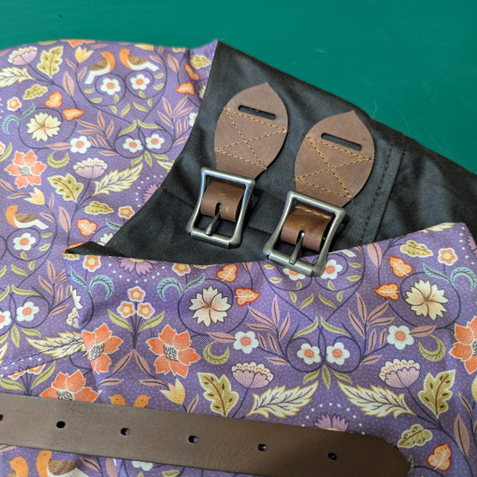 British-made waxed cotton riding habit in vintage brown lined with a purple floral design.