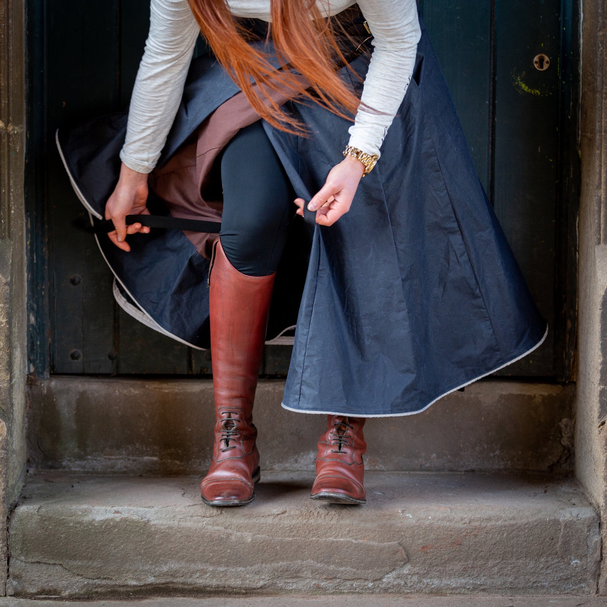 Close up of our handcrafted riding habit having the leg straps altered.