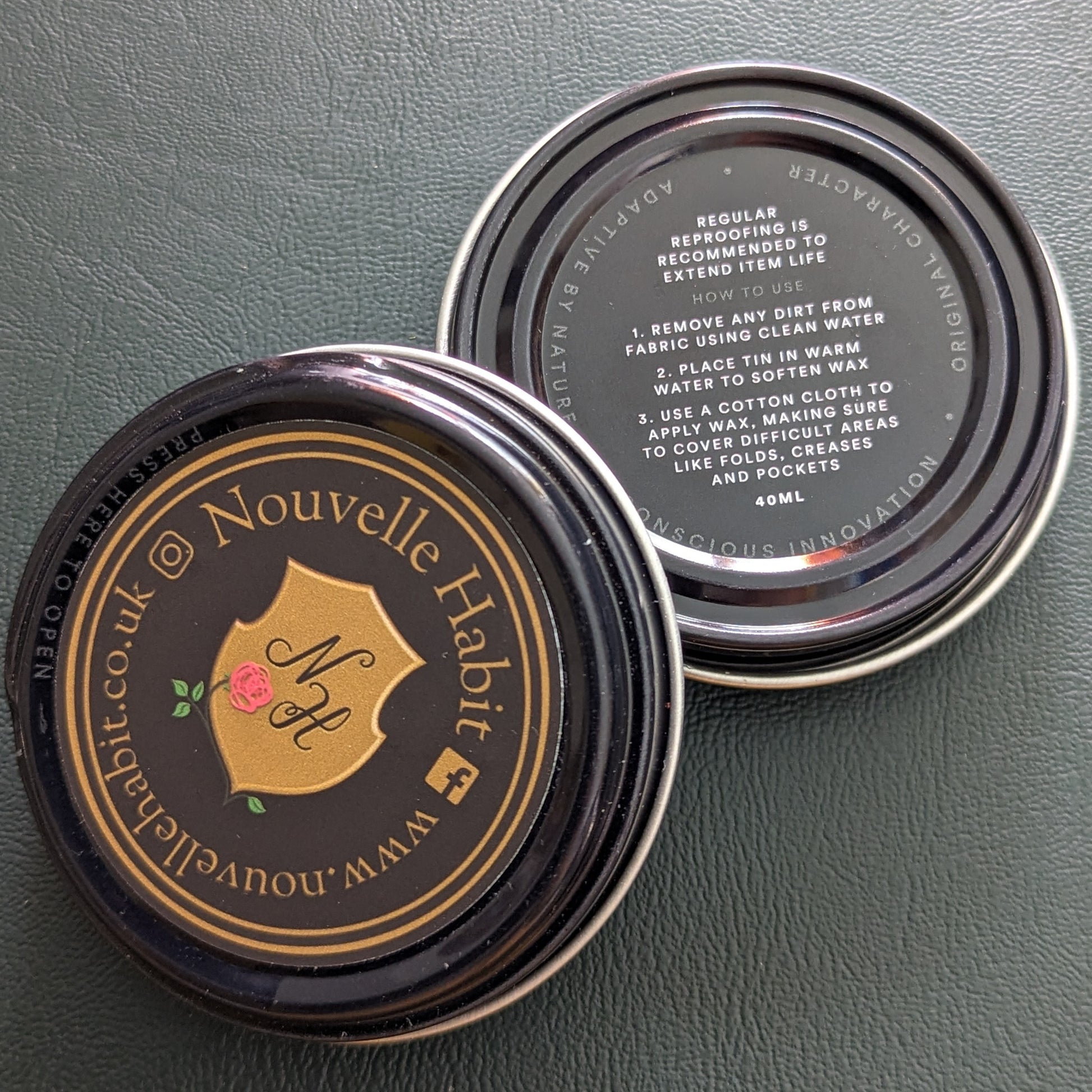 Wax pot's showing the care instuctions on the bottom and the Nouvelle Habit logo on top.