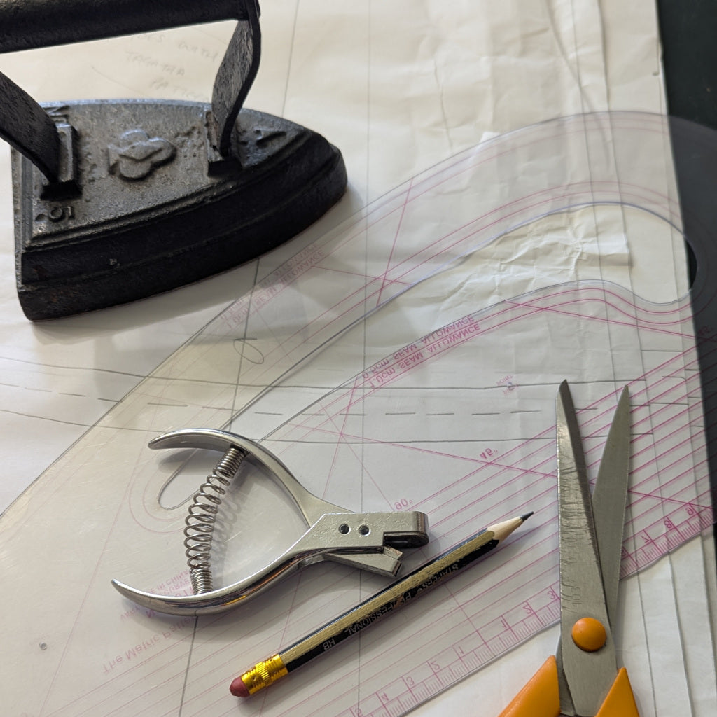 Close up of a selection of pattern designing and cutting tools.